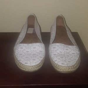 White eyelet flats